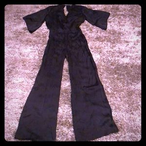 Bebe women’s black jumpsuit size S preowned
